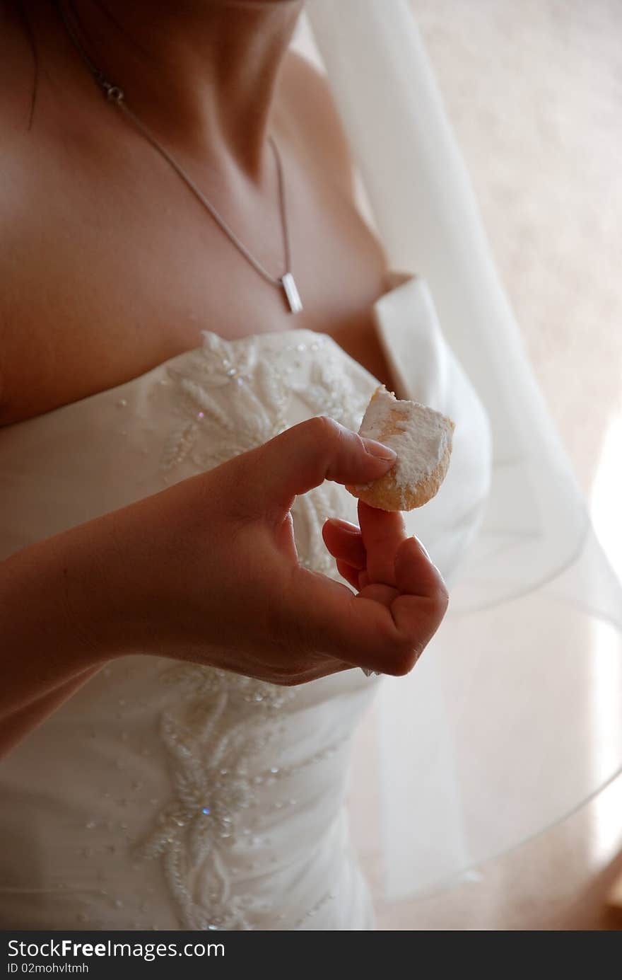 Bride eating a sweet cake