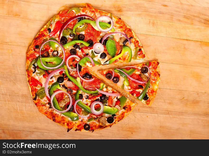 Pizza with vegetables and pepperoni