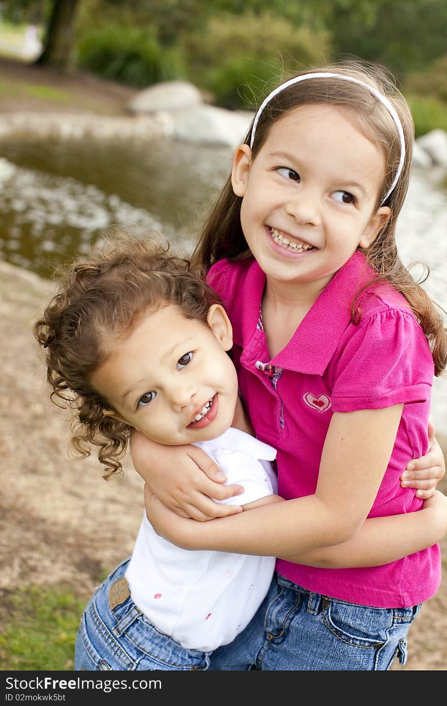 Cute little sisters playing outside