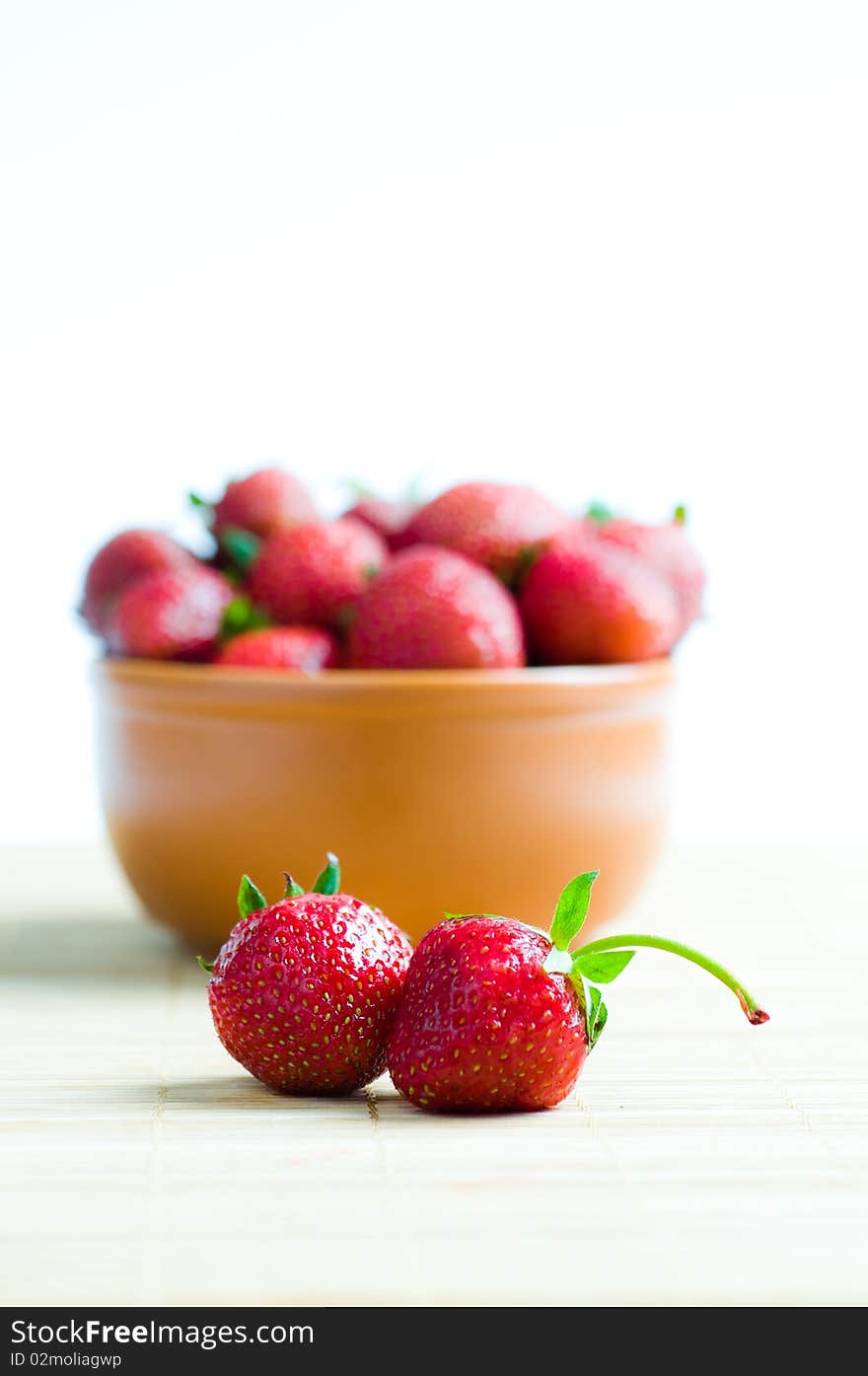 Ripe strawberries on bamboo background