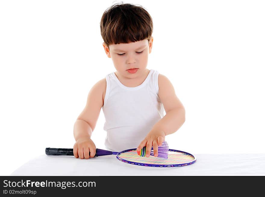 Little boy with a tennis racket on a white background. Little boy with a tennis racket on a white background