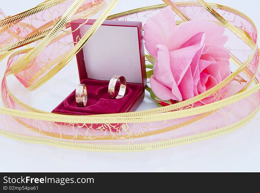 Rose and wedding rings. You can you it for wedding card