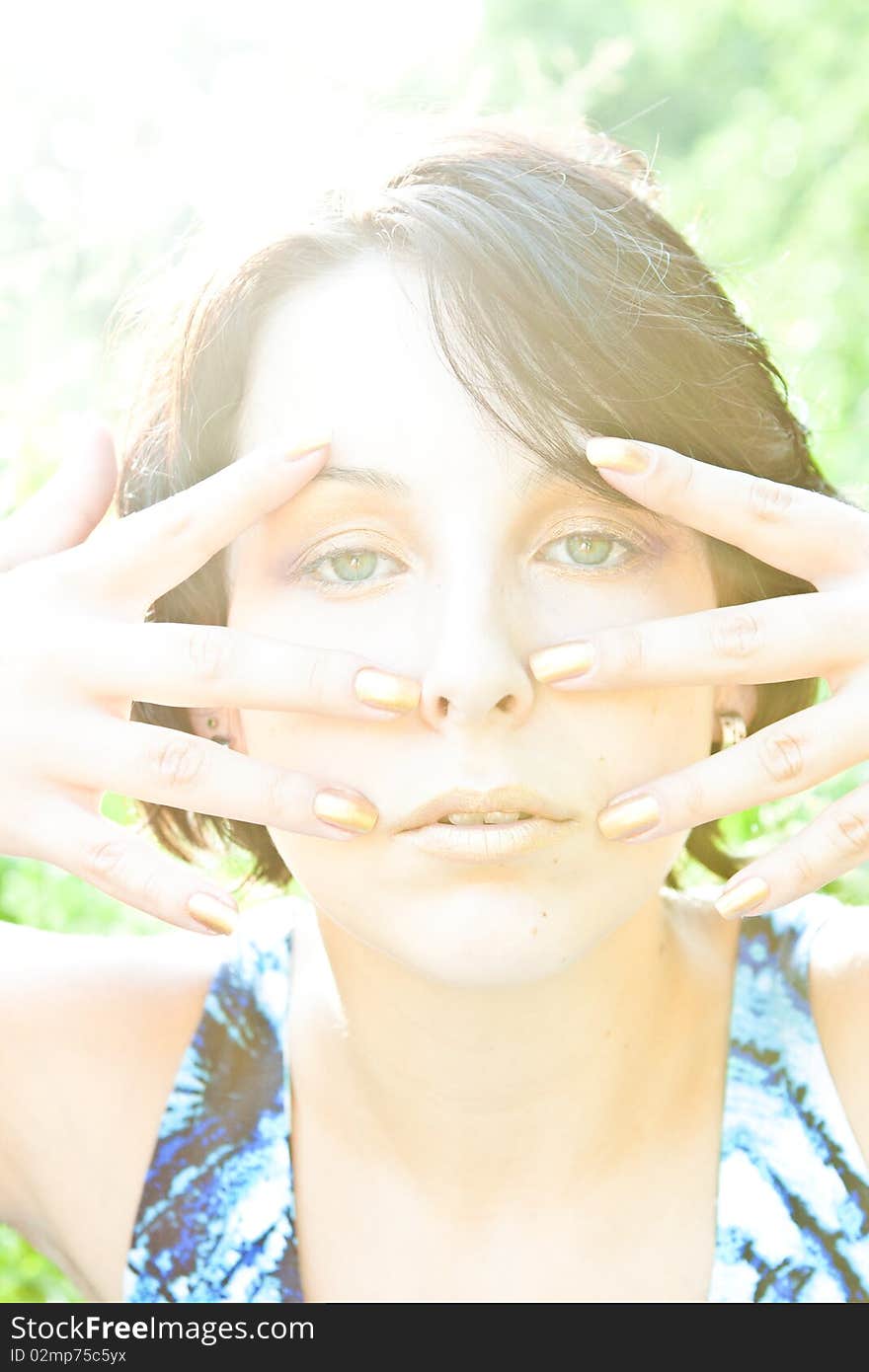 Woman delicate face in golden sunlight. Woman delicate face in golden sunlight