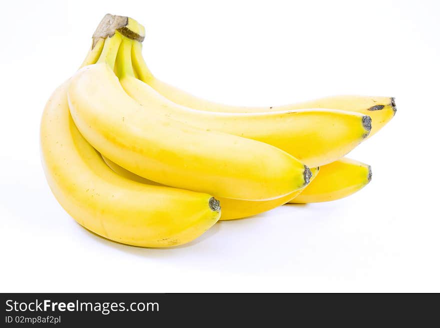 Several yellow bananas isolated on white background