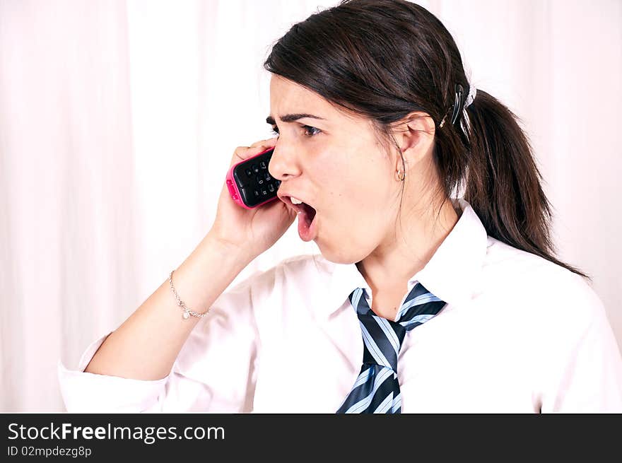 Female office worker having telephone conversation with client or customer