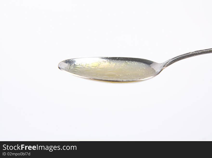 Chicken soup on a spoon