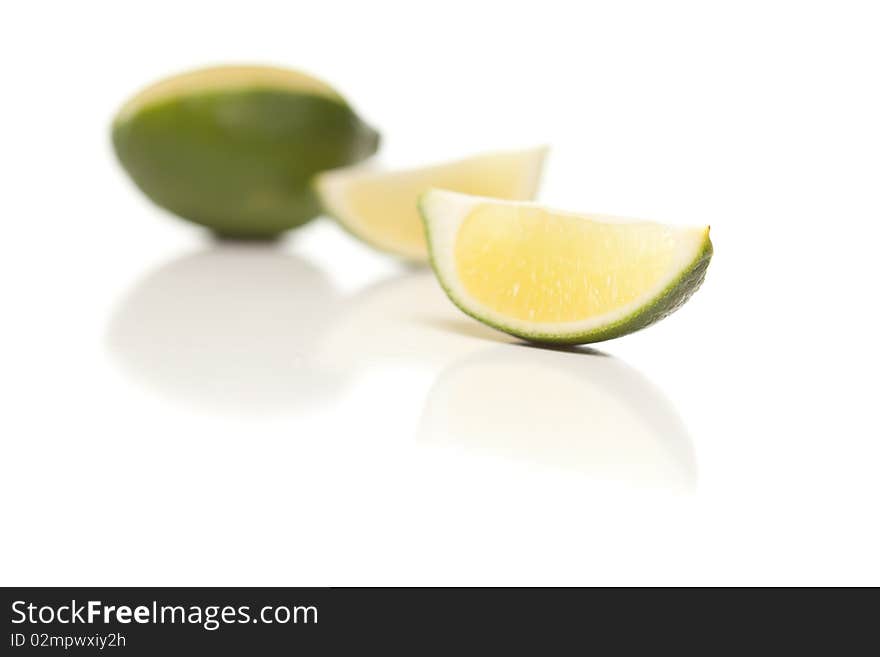 Sliced Lime on Reflective White Surface