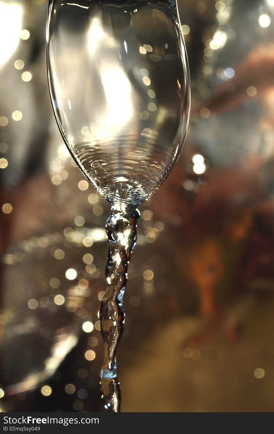 Water bubble dripping from the kitchen faucet