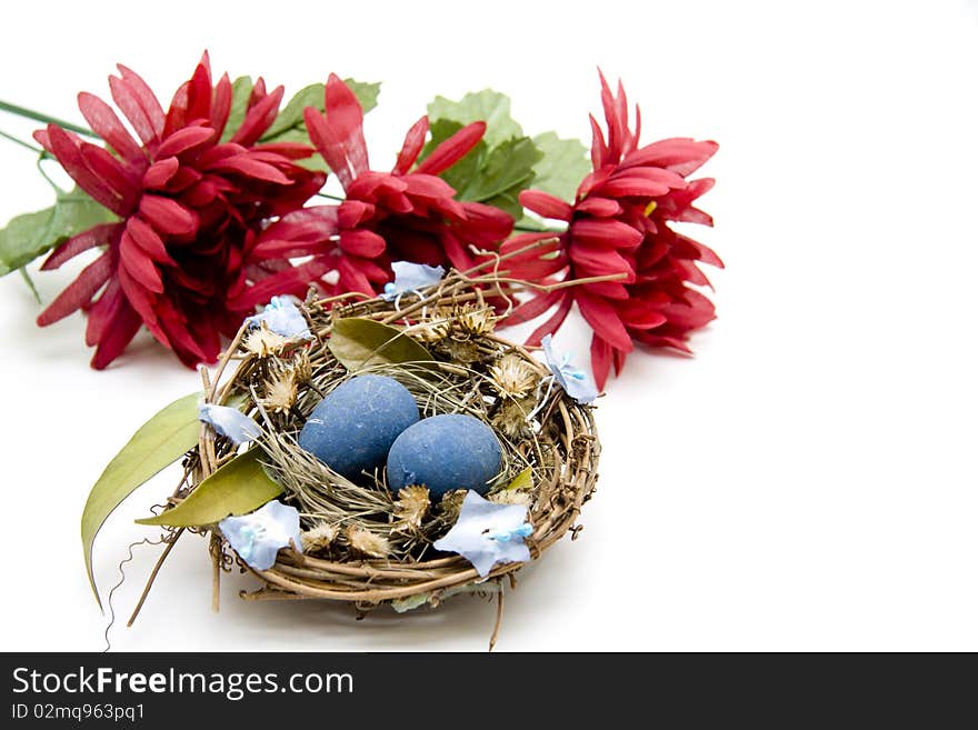 Blue easter-eggs with red flower blossoms. Blue easter-eggs with red flower blossoms