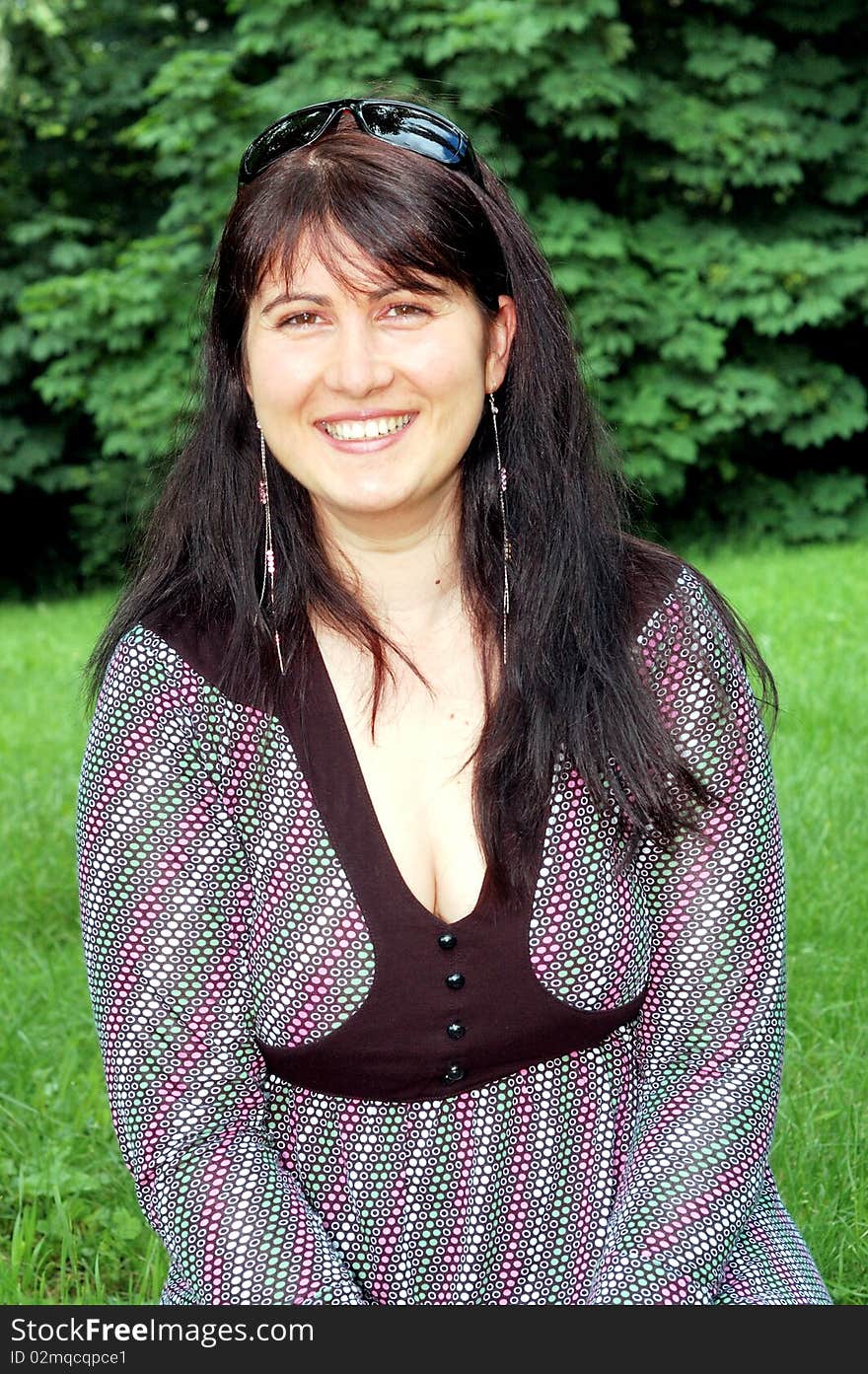 Portrait of beautiful woman in a green park. Portrait of beautiful woman in a green park