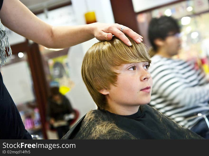 Young boy  at the hairdresser