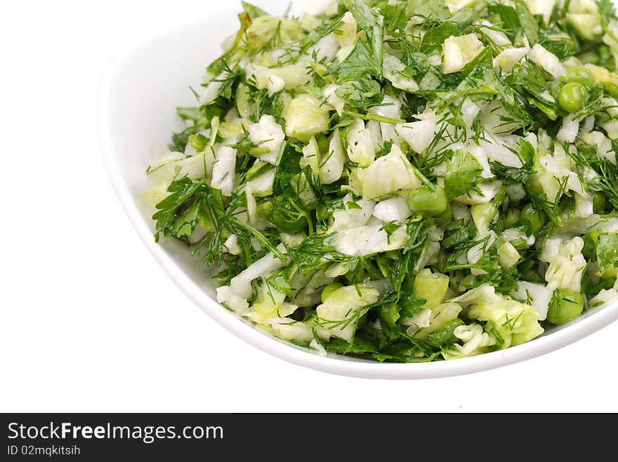 Fresh salad from vegetables and greens on a plate