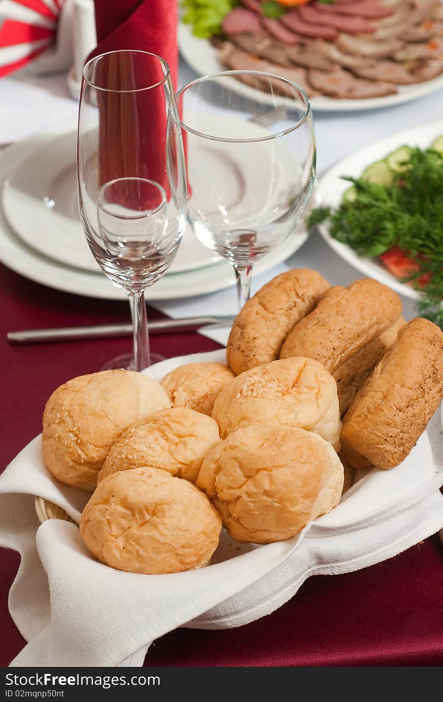 Small rolls of bread on a celebratory table. Small rolls of bread on a celebratory table.