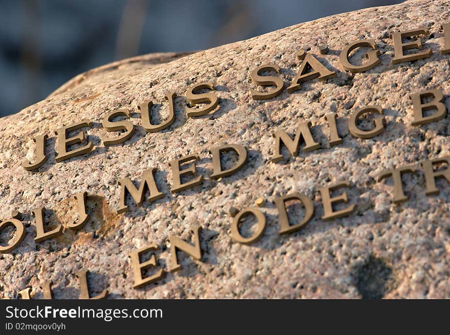 Stone monument with metal letters in swedish. Located in south Sweden. Stone monument with metal letters in swedish. Located in south Sweden