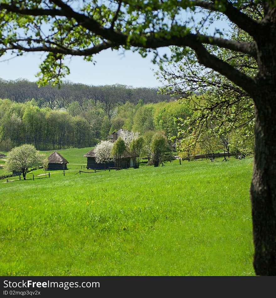 Old houses on beautiful green meadow. Old houses on beautiful green meadow