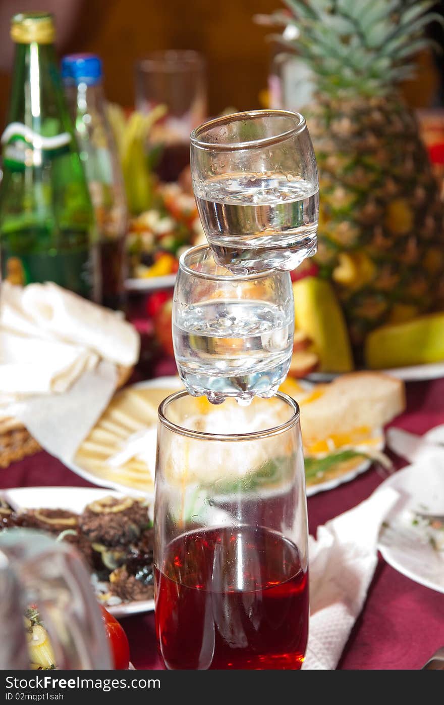 Balance of a pyramid from alcoholic drinks - an entertainment of a celebratory party. Balance of a pyramid from alcoholic drinks - an entertainment of a celebratory party.