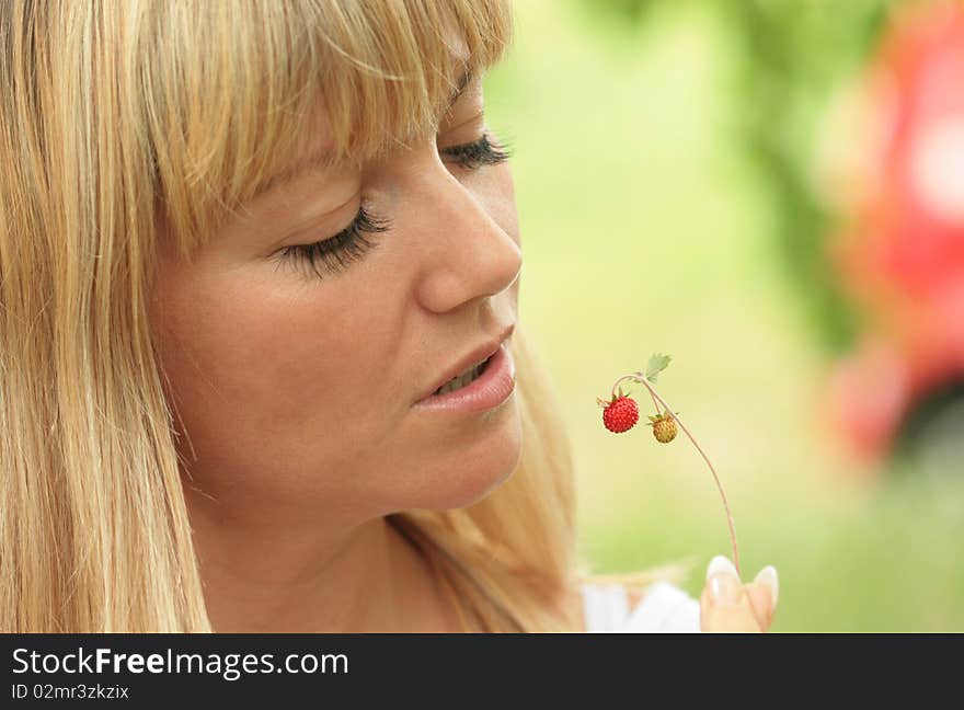 Portrait of the blonde with berries