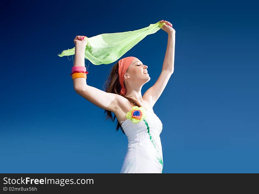 Girl with kerchief on blue background