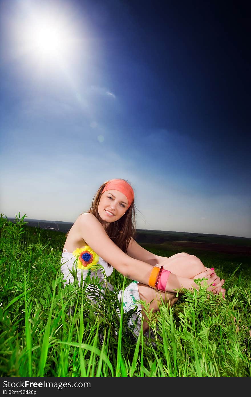 Long-haired girl on green grass. Long-haired girl on green grass