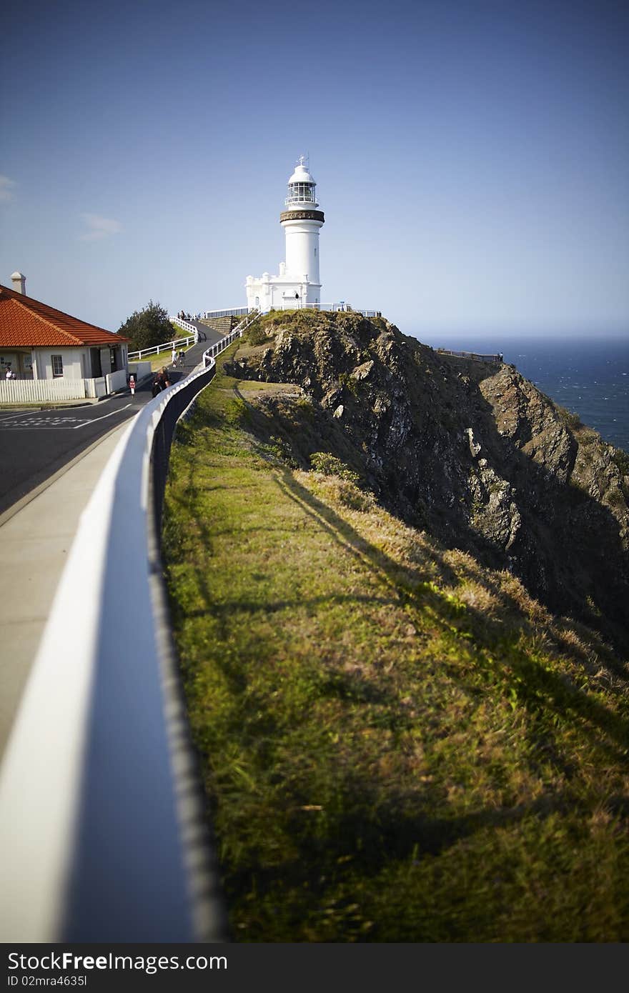 Lighthouse on a sunny day overlooking ocean