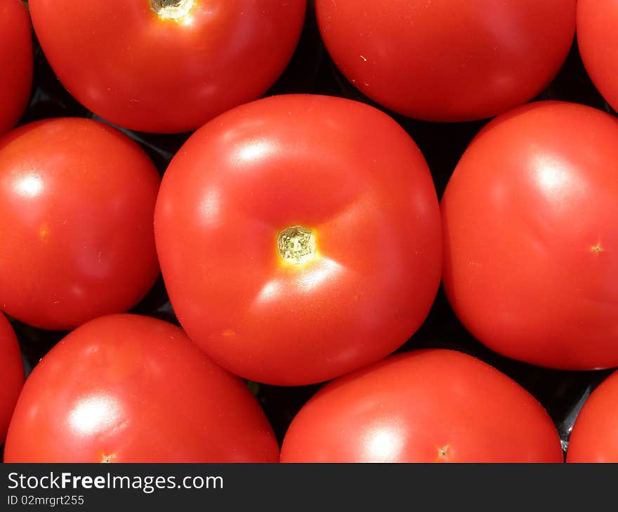 Detail photo texture of tomatoes background. Detail photo texture of tomatoes background