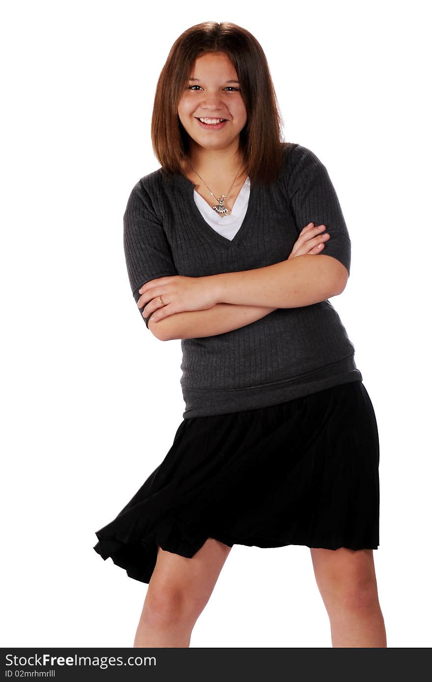 An attractive young teen swishing her black, pleated skirt. An attractive young teen swishing her black, pleated skirt.