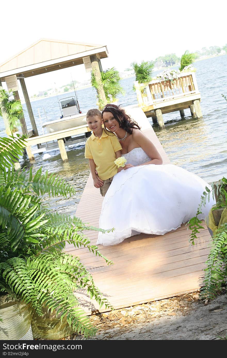 Beautiful Bride With Child On Dock