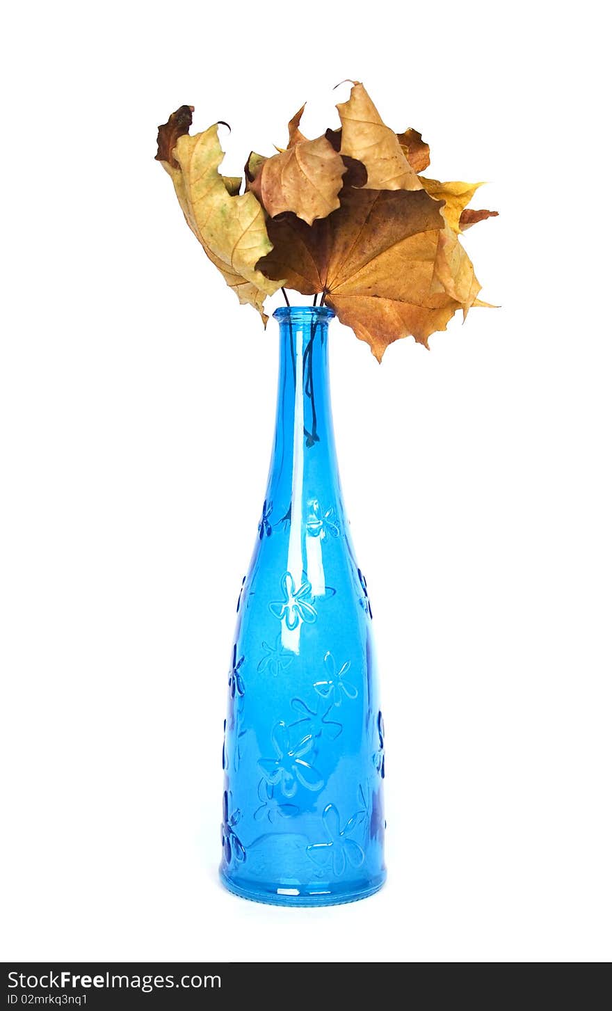 Blue design decorative bottle with wither maple leaves. Blue design decorative bottle with wither maple leaves