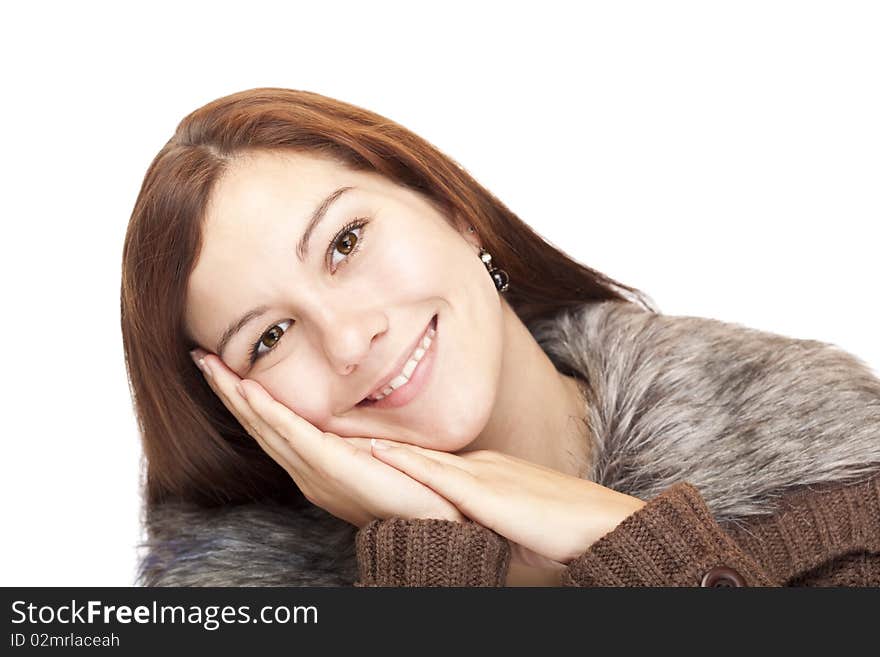 Closeup of a beautiful happy woman leaning with head on palm. Isolated on white background.