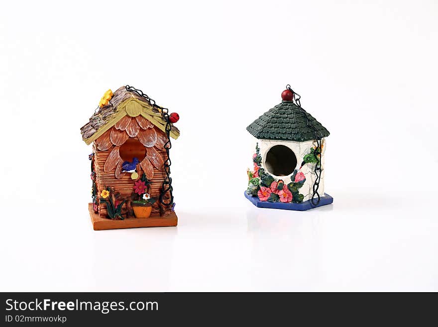 Hanging ceramic bird houses with chaines