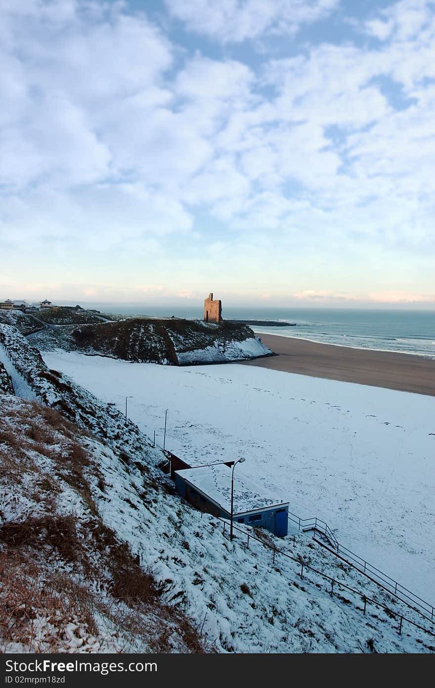 Snow Covered Cliffs With Coast View