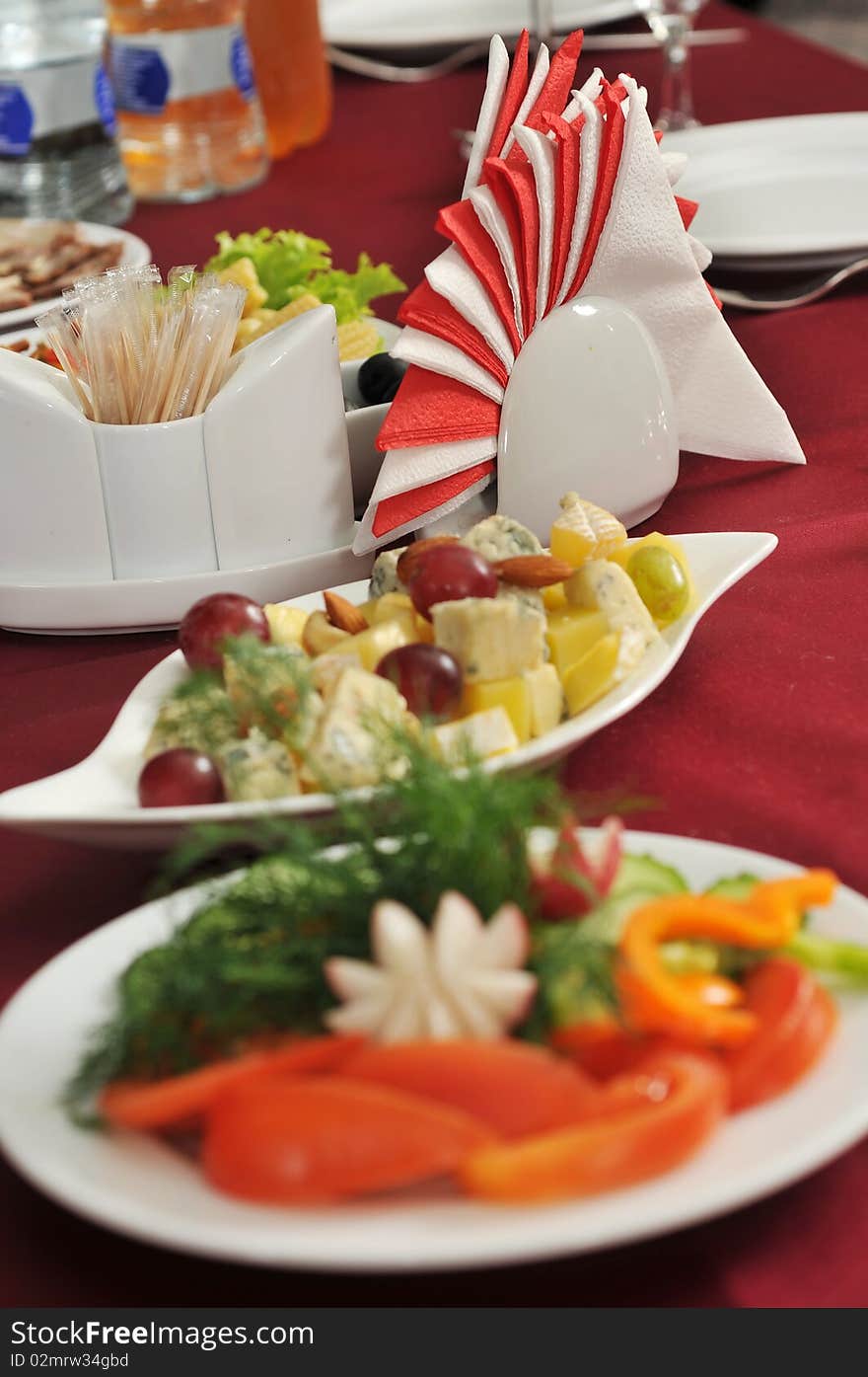 Appetizer, napkins on a celebratory banquet table. Appetizer, napkins on a celebratory banquet table.