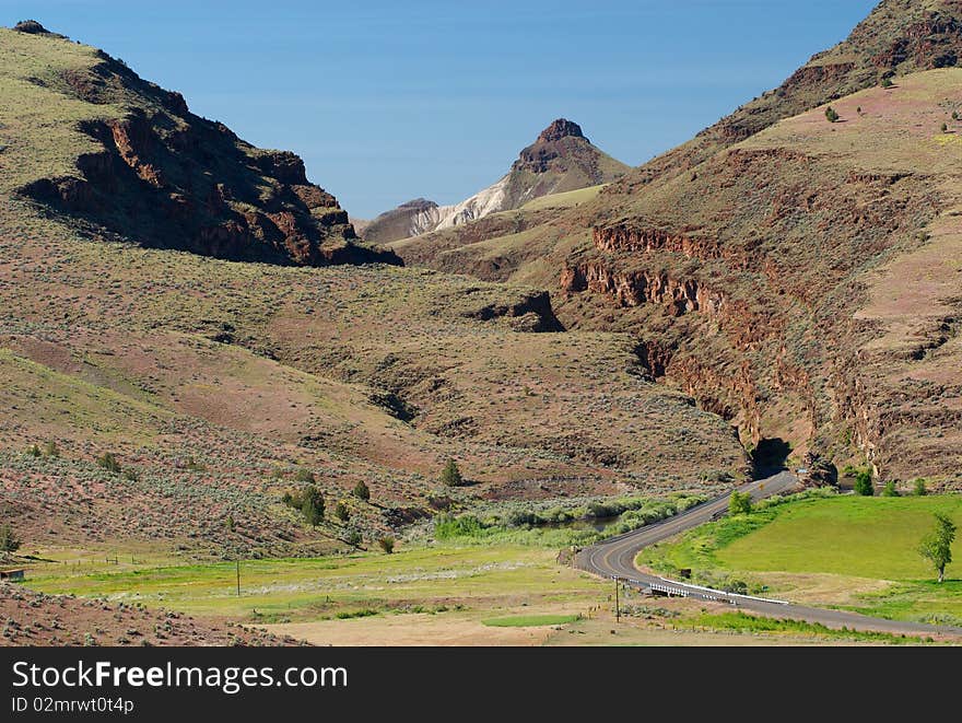 A highway winds into the mountains of eastern Oregon. A highway winds into the mountains of eastern Oregon