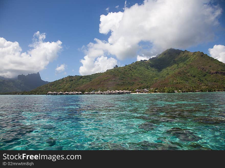 Water bungalows in the turquoise lagoon of Moorea, French Polynesia. Water bungalows in the turquoise lagoon of Moorea, French Polynesia.