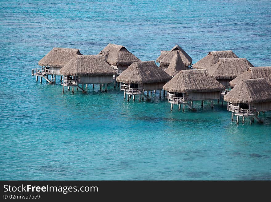 Water bungalows in the turquoise lagoon of Moorea, French Polynesia. Water bungalows in the turquoise lagoon of Moorea, French Polynesia.