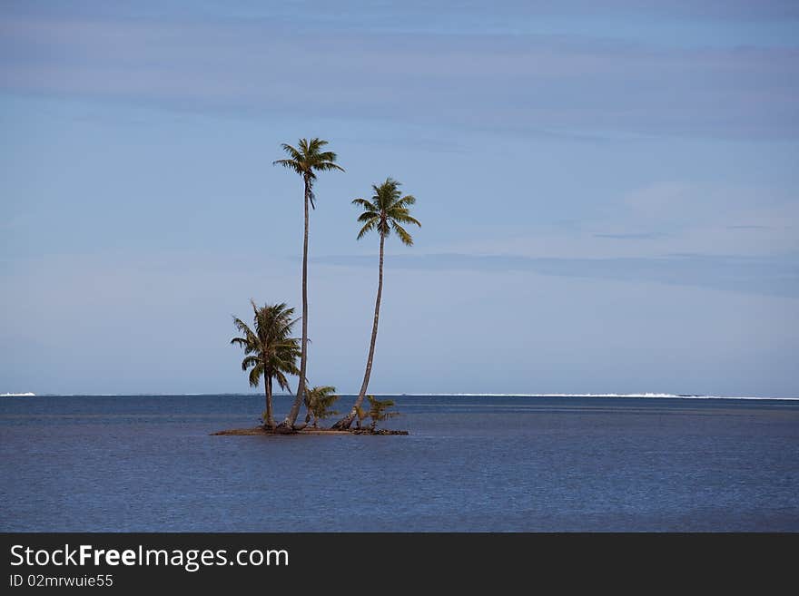 Motu (island) in the South Pacific before the island of Raiatea, French Polynesia. Motu (island) in the South Pacific before the island of Raiatea, French Polynesia.