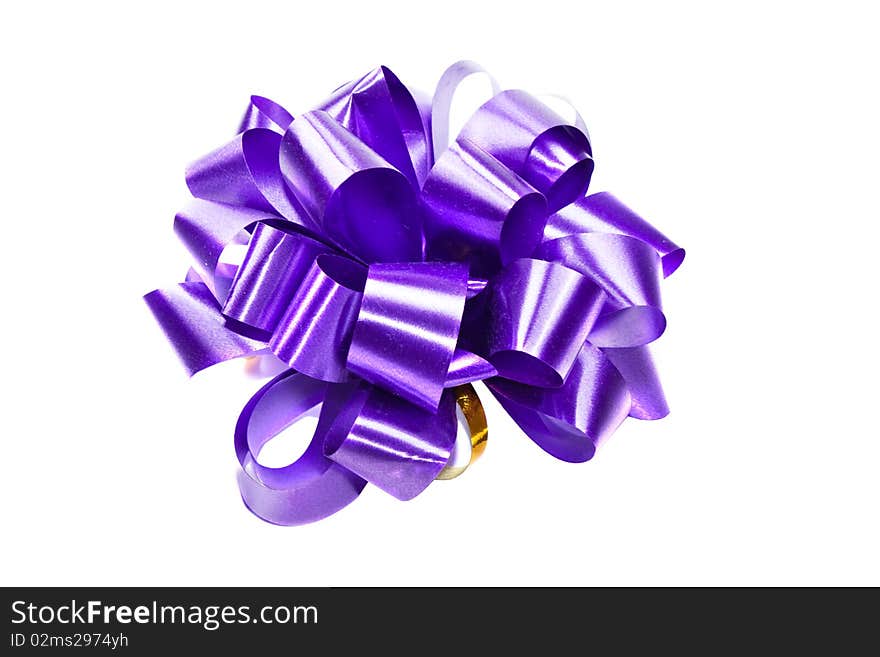 Isolated violet ribbon bow for present box