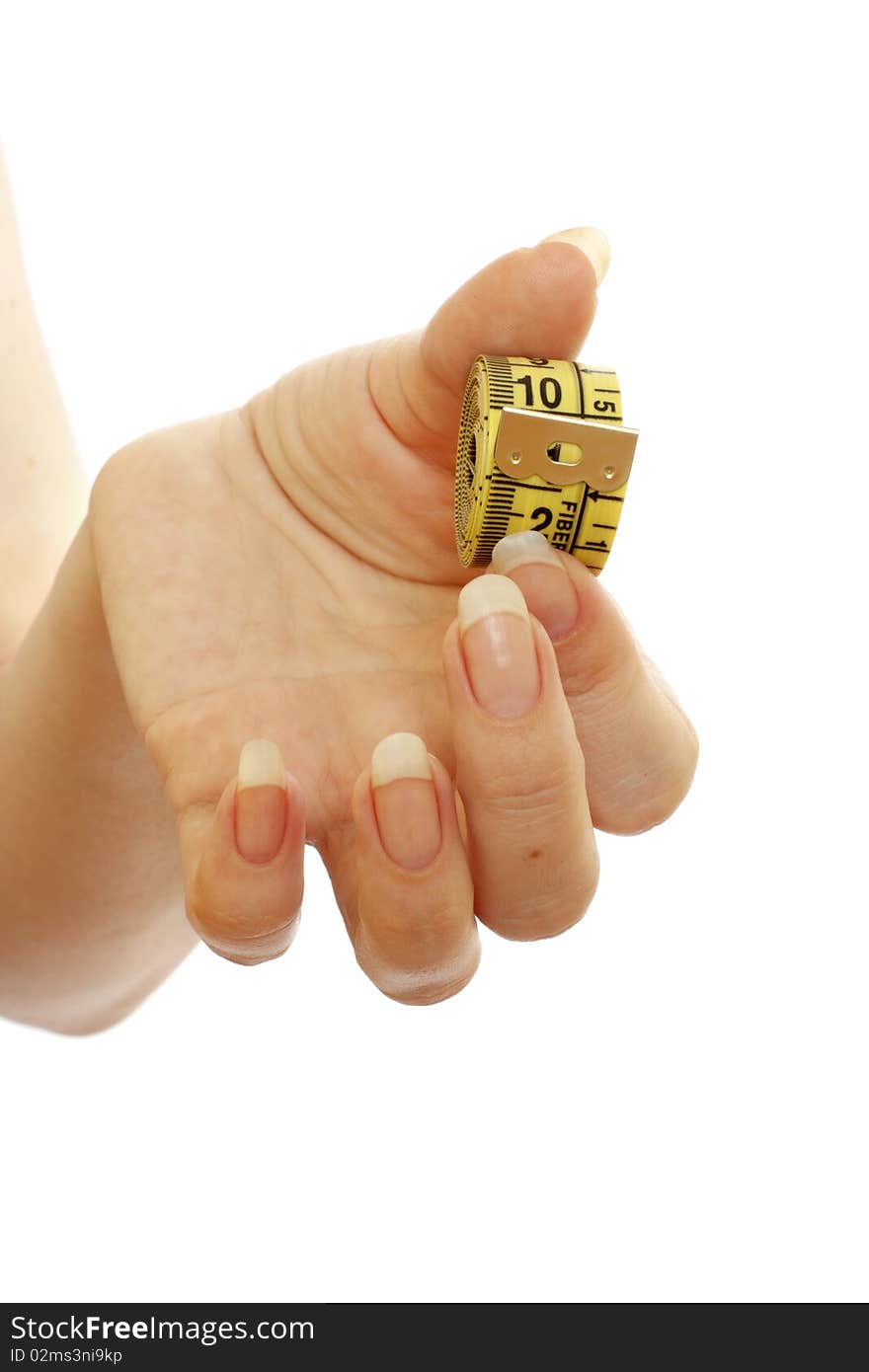 Tape measure in a beautiful female hand isolated on white background