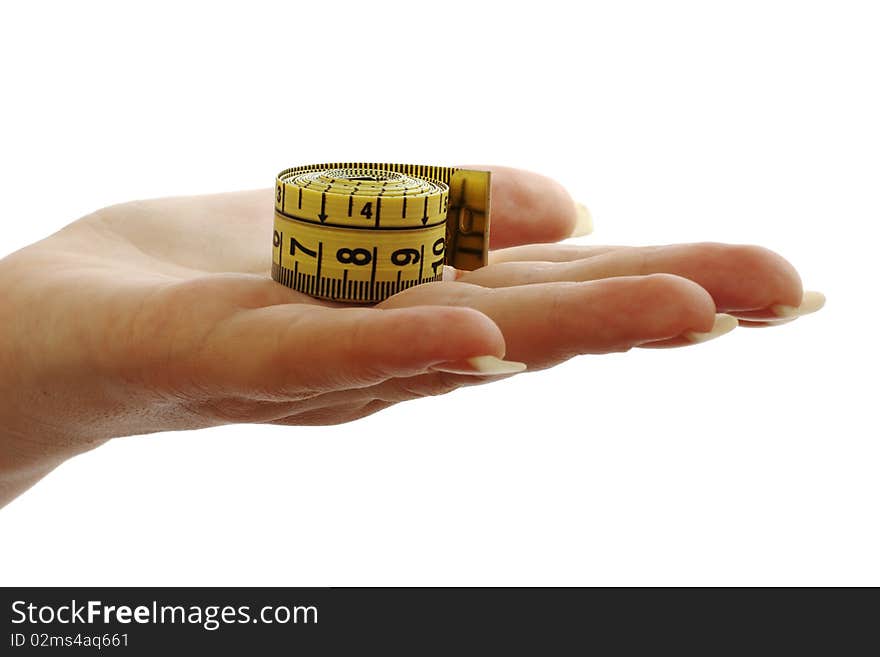 Tape measure in a beautiful female hand isolated on white background