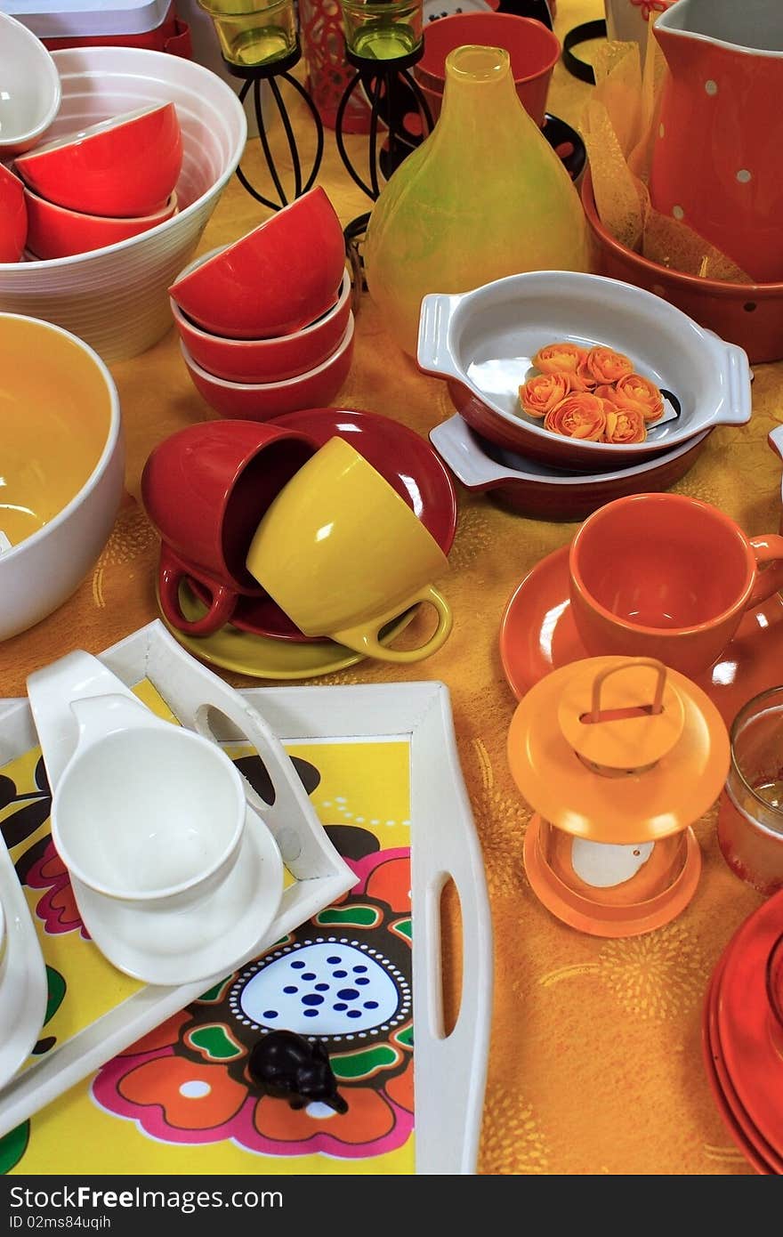 Table with colorful cups and saucers, tea and coffee. Table with colorful cups and saucers, tea and coffee