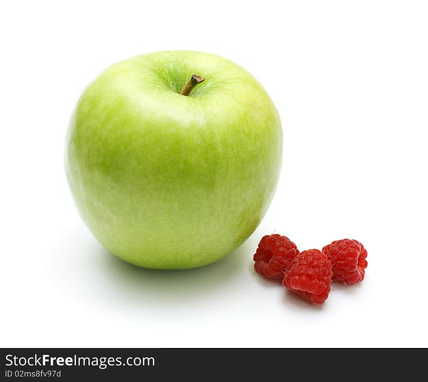 Isolated green apple and red raspberry  - vitamins, nature and healthy lifestyle. Isolated green apple and red raspberry  - vitamins, nature and healthy lifestyle