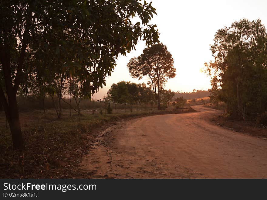 Dirt curvy road heading to unseen Thailand