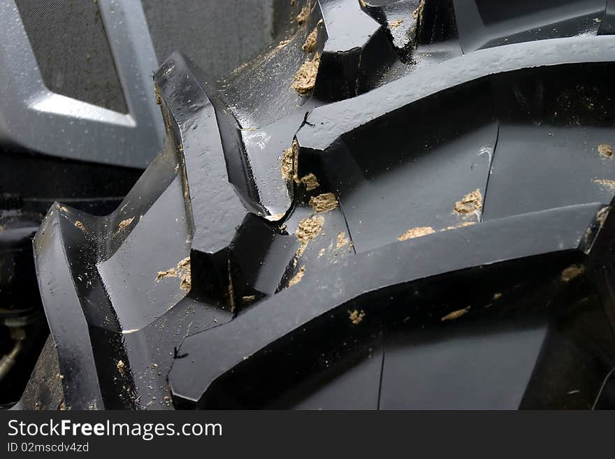 Close-up of tractor tire tread as background. Close-up of tractor tire tread as background.