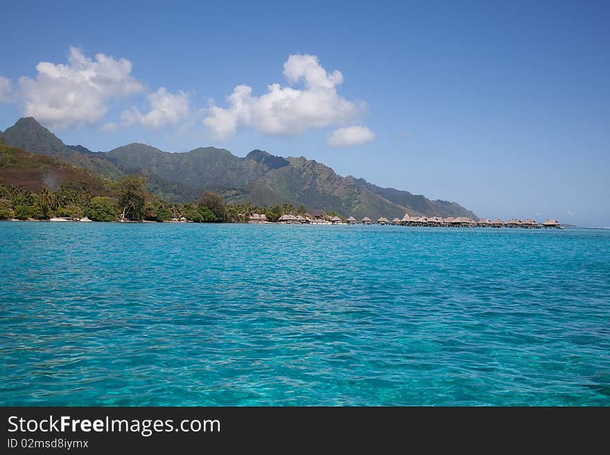 Water bungalows in the turquoise lagoon of Moorea, French Polynesia. Water bungalows in the turquoise lagoon of Moorea, French Polynesia.