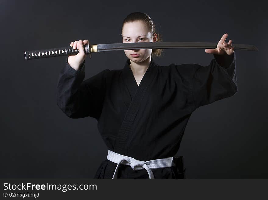 Portrait of female samurai holding katana