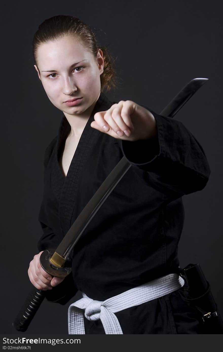 Portrait of female samurai holding katana