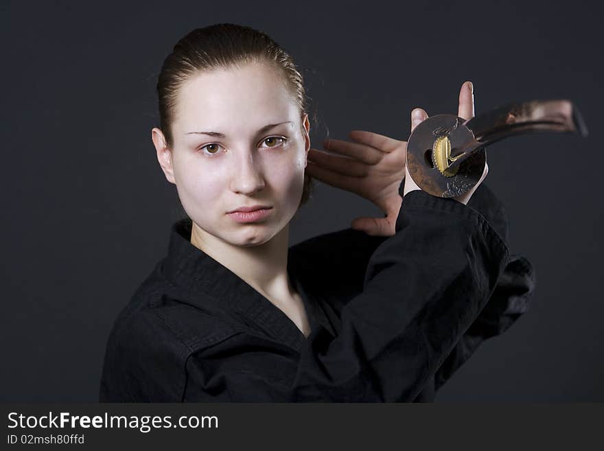 Female samurai holding katana