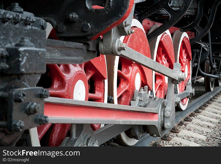 Old steam engine wheels close-up, horizontal
