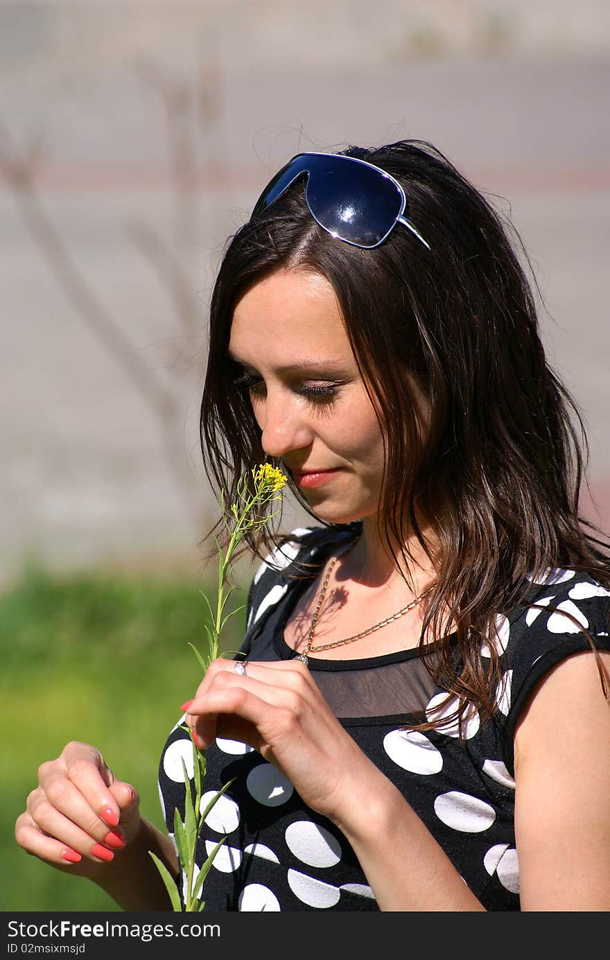 Beauty brunette girl and yelloy flower. Beauty brunette girl and yelloy flower