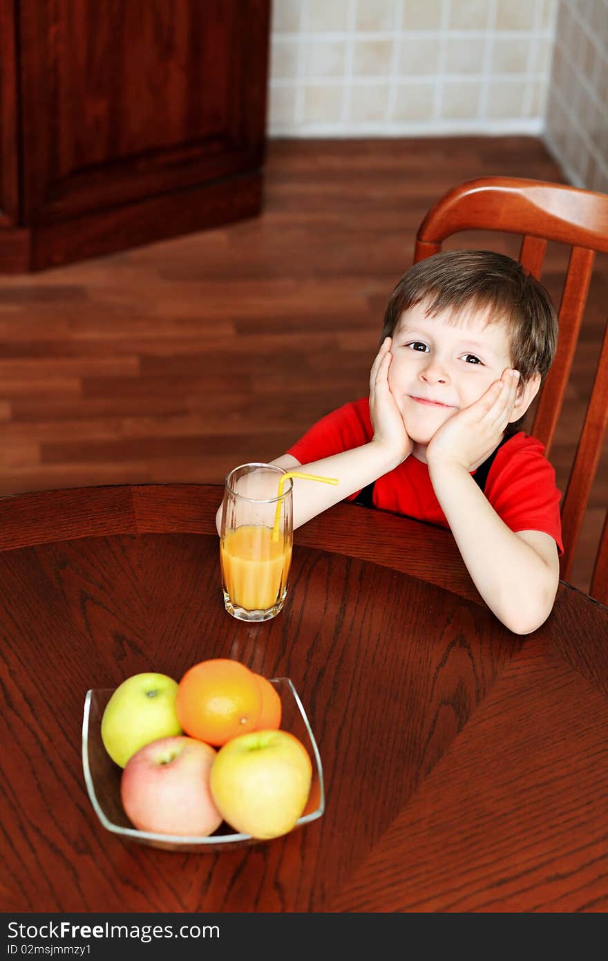 Little boy is drinking a juice at home. Little boy is drinking a juice at home.